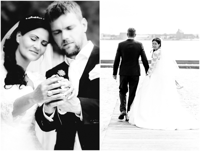 Hochzeitsfotografie, Hochzeitspaar steht verliebt zusammen und hält eine Blume in der Hand - Hochzeitsfotografie in Altefähr - Hochzeitsfotograf_Ruegen_Stralsund